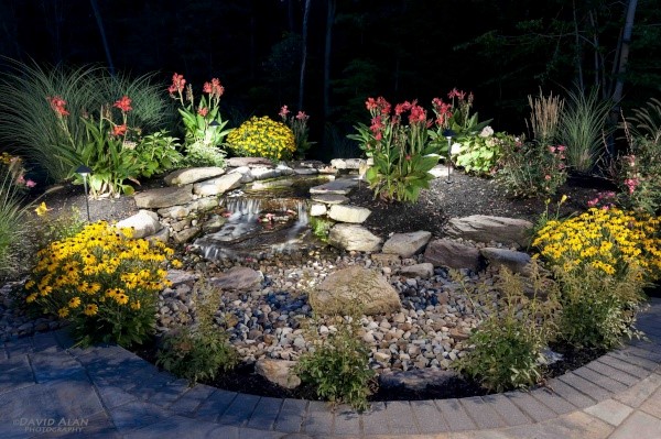 Landscape Enhancements like this Waterfall will Take Your Property to the Next Level
