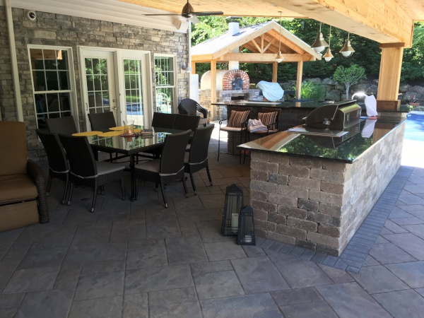 Heat-proof Outdoor Living Space with Overhead Cedar Covered Kitchen in Richfield Ohio
