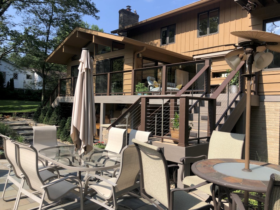 Cleveland Landscaping Company Project Outdoor Patio Dining Area with Elevated Deck in the Background
