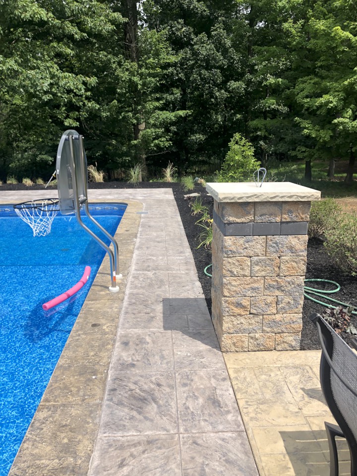 Cleveland Landscaping Company Project Pool & Pool Deck with Pillar and Landscaped Bed
