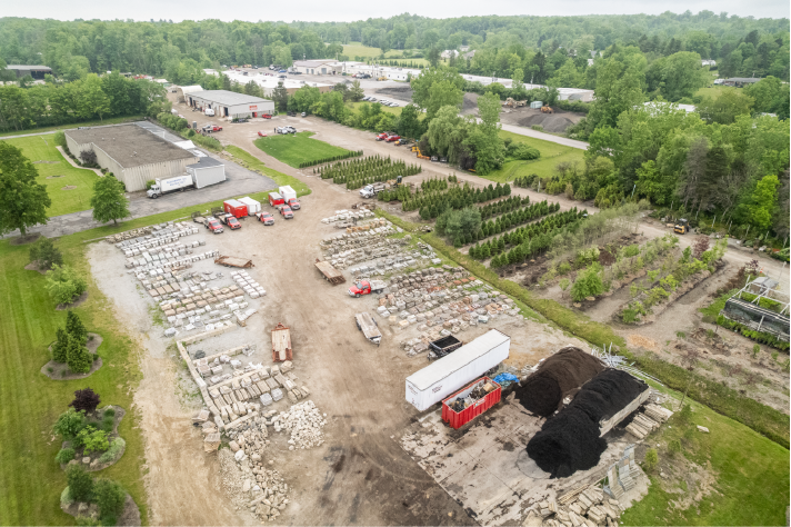 hm-landscaping-aerial-facility-newbury-ohio Aerial view of H&M Landscaping facility in Newbury Ohio showing nursery operations, equipment storage, and commercial landscaping materials