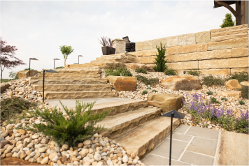 stone-steps-hardscape-design Custom stone steps with retaining walls and plants in a professional landscape design