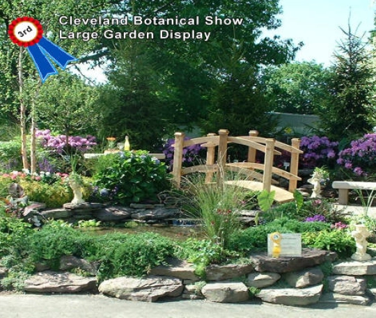 Large Garden Display award from the Cleveland Botanical Show featuring a decorative bridge and layered garden installation, shown in Award-13.webp.