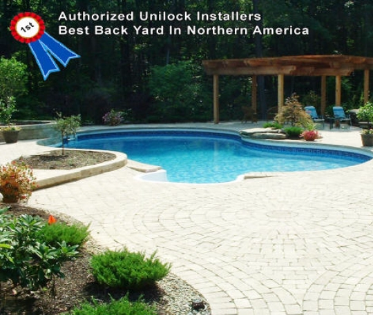 First place Best Back Yard in Northern America award from Authorized Unilock Installers, featuring a custom pool and patio design in Award-11.webp.